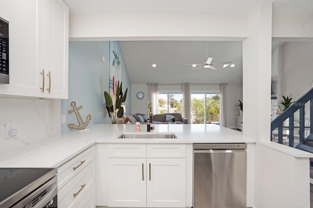 kitchen with white cabinetry, sink, kitchen peninsula, and dishwasher