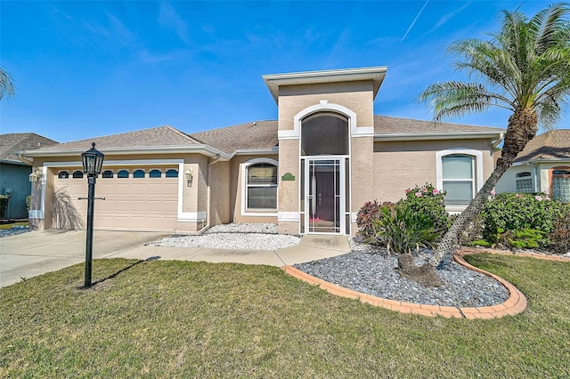 view of front of house with a garage and a front lawn