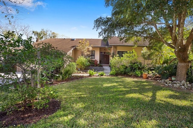 view of front of home with a front lawn