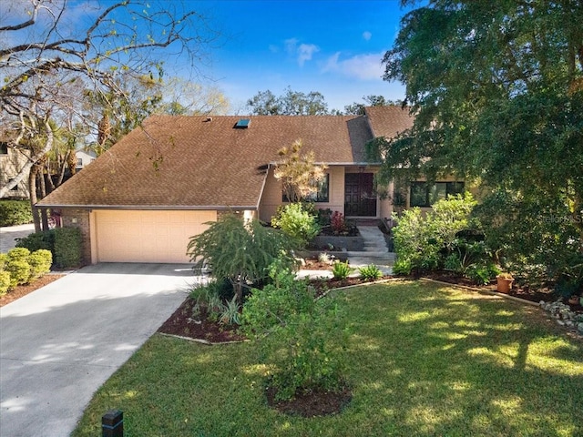 view of front facade featuring a garage and a front lawn