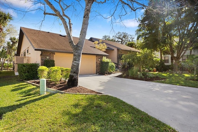 view of front of house featuring a garage and a front yard