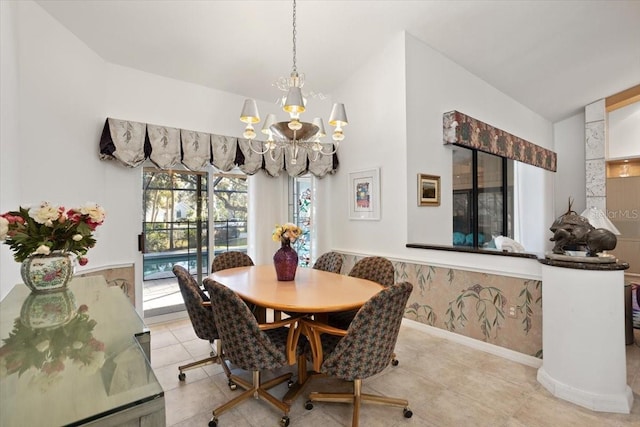 tiled dining space featuring lofted ceiling and a notable chandelier