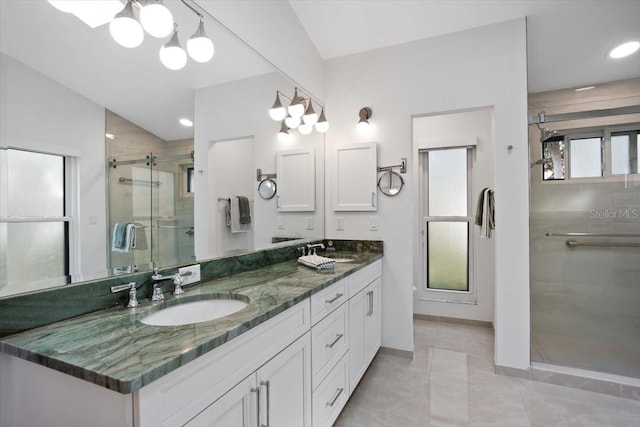 bathroom with vanity, tile patterned floors, and walk in shower