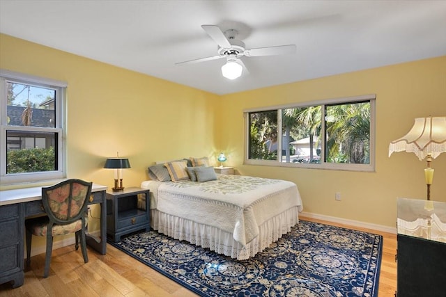 bedroom with hardwood / wood-style flooring and ceiling fan