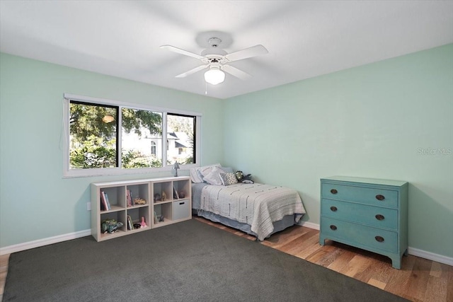 bedroom featuring ceiling fan and light hardwood / wood-style flooring