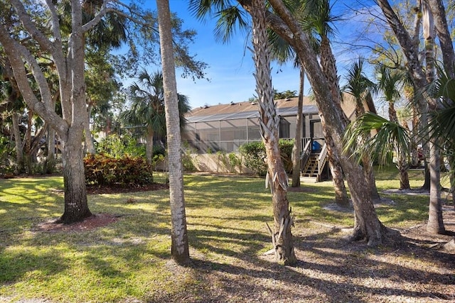 view of yard with a lanai