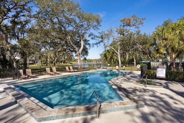 view of swimming pool with a patio