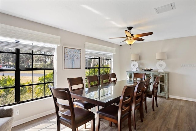 dining space featuring ceiling fan and wood-type flooring