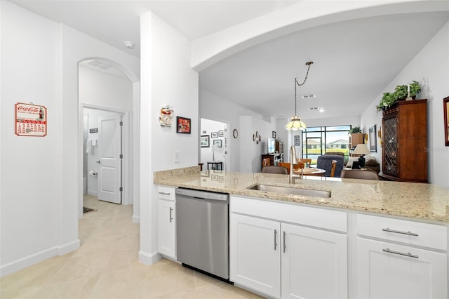 kitchen featuring decorative light fixtures, dishwasher, sink, white cabinets, and light stone counters