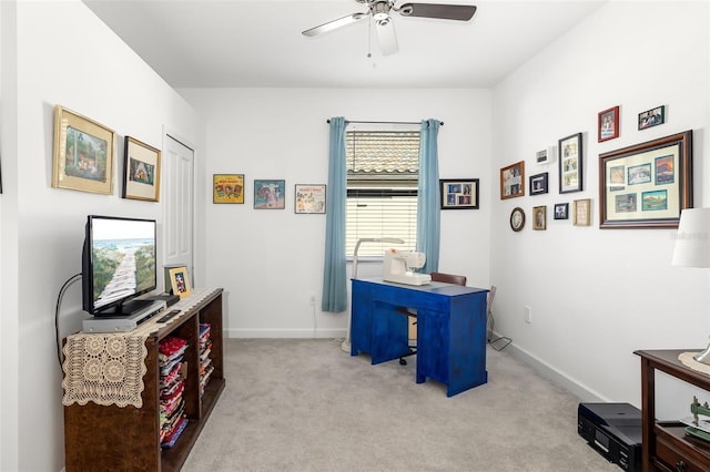 carpeted home office with ceiling fan