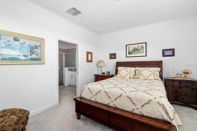 carpeted bedroom featuring connected bathroom