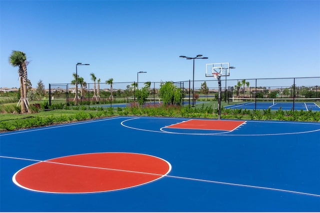 view of basketball court featuring tennis court