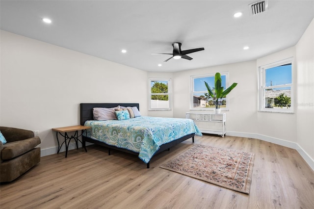 bedroom with ceiling fan and hardwood / wood-style floors