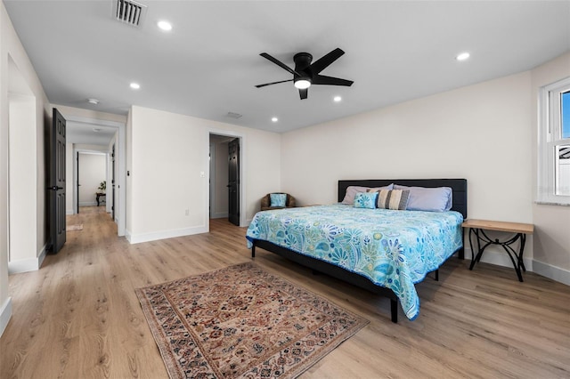 bedroom featuring ceiling fan and light hardwood / wood-style floors