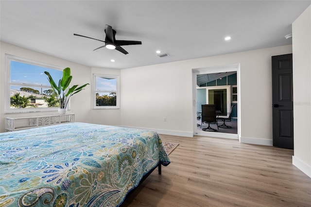 bedroom with ceiling fan and light hardwood / wood-style flooring