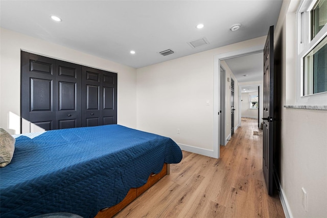 bedroom with light hardwood / wood-style floors