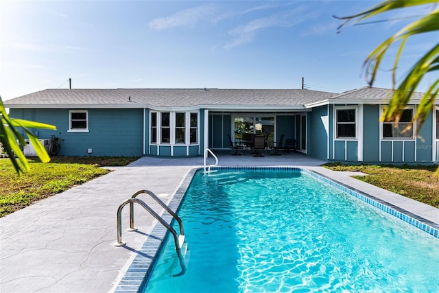 view of swimming pool with a patio area