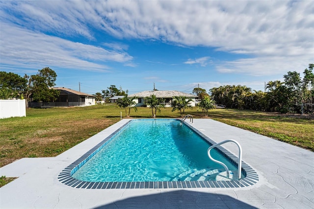 view of pool with a yard and a patio area