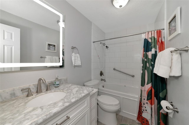 full bathroom featuring vanity, toilet, a textured ceiling, and shower / bathtub combination with curtain