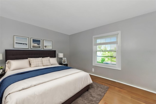 bedroom with wood-type flooring