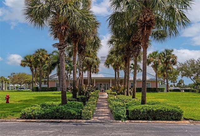 view of front of home featuring french doors and a front lawn