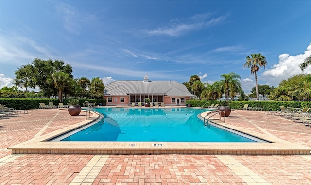 view of swimming pool featuring a patio area