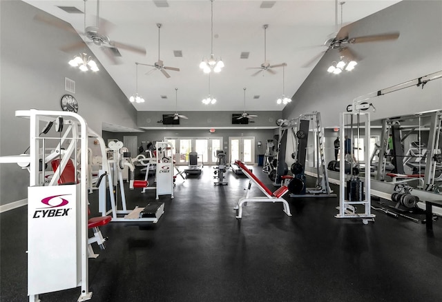 exercise room with high vaulted ceiling