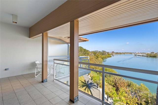 balcony featuring a water view