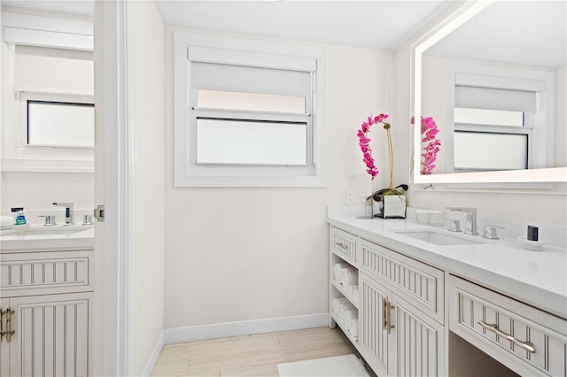 bathroom with vanity and a wealth of natural light