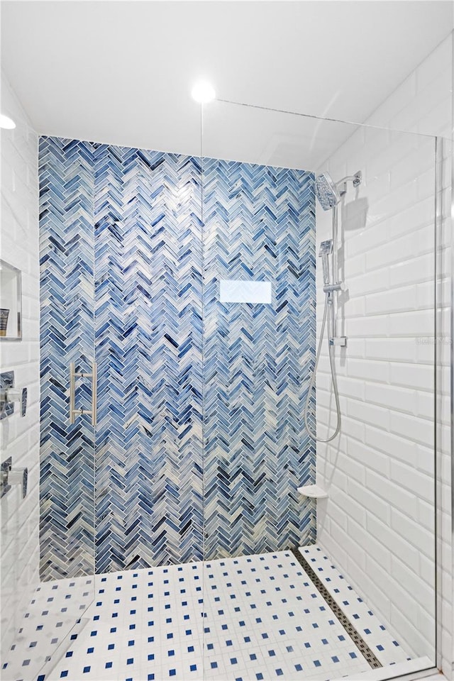 bathroom with a shower with shower door