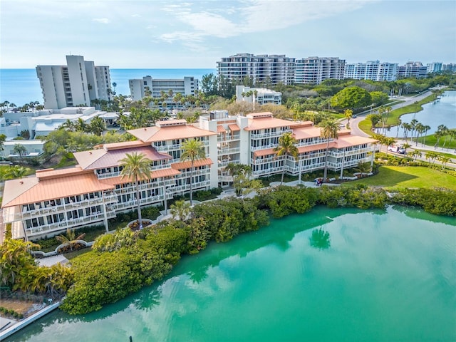 birds eye view of property with a water view