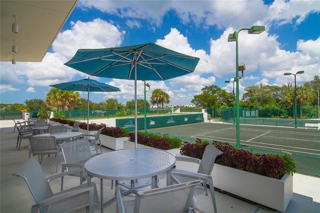 view of patio / terrace featuring tennis court