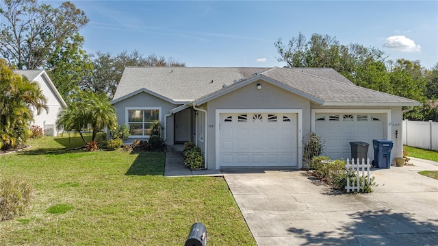 ranch-style house with a garage and a front lawn