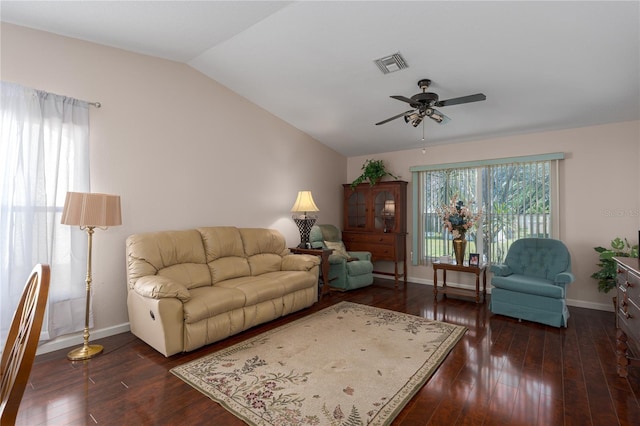 living room featuring vaulted ceiling, ceiling fan, and dark hardwood / wood-style flooring