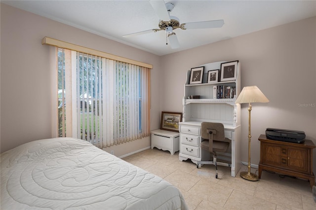 tiled bedroom with ceiling fan