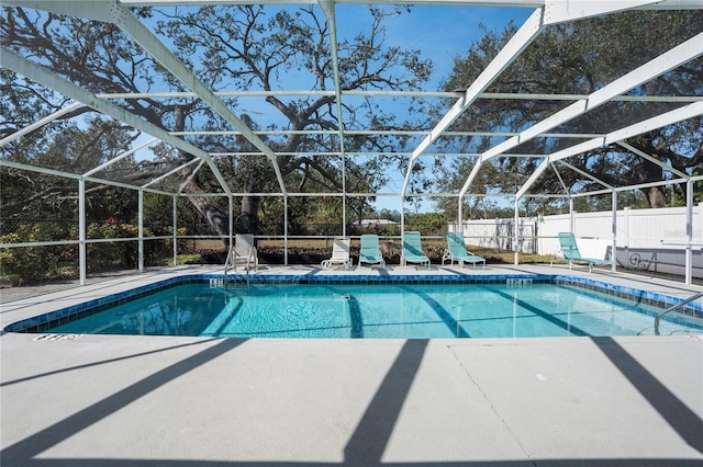 view of pool featuring a lanai and a patio