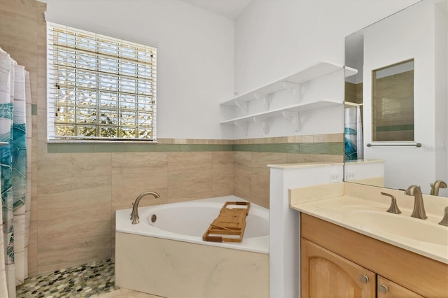 full bathroom with curtained shower, a bath, and vanity