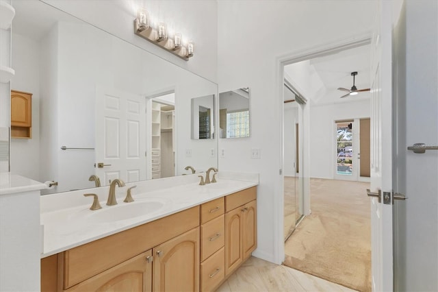 full bathroom with ceiling fan and double vanity