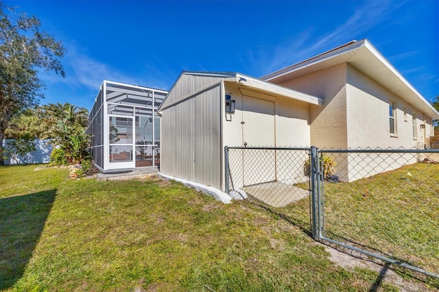 view of property exterior with glass enclosure