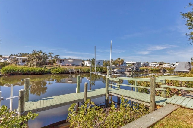 dock featuring a water view and a residential view