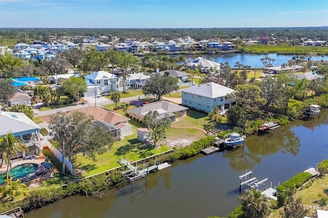 aerial perspective of suburban area with a nearby body of water
