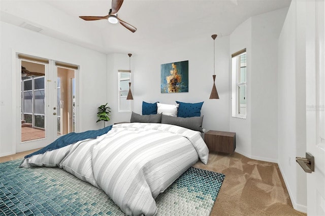carpeted bedroom with access to outside, baseboards, and a ceiling fan