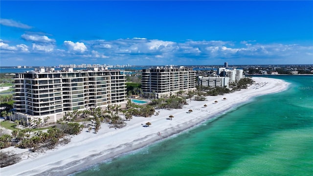 bird's eye view with a beach view and a water view