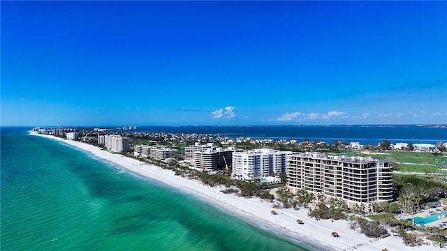 birds eye view of property featuring a water view and a view of the beach