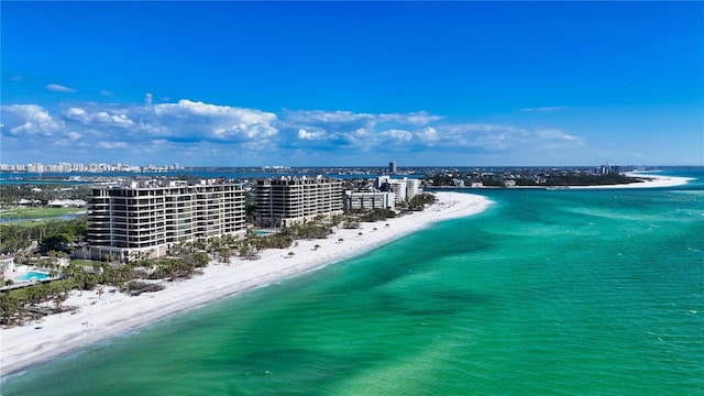 drone / aerial view featuring a view of the beach and a water view