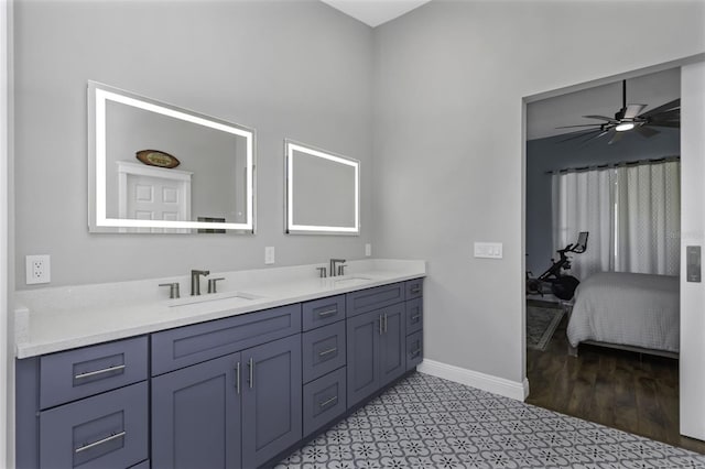 bathroom featuring ceiling fan and vanity