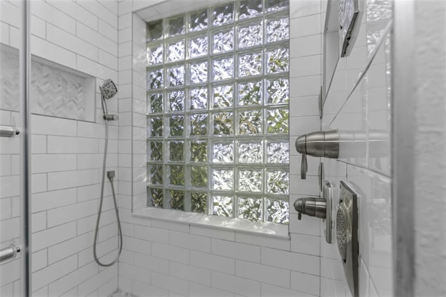 bathroom with tiled shower