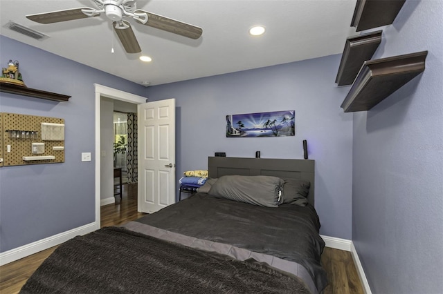 bedroom with dark wood-type flooring and ceiling fan