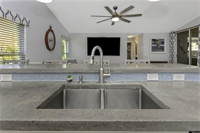 kitchen featuring lofted ceiling, sink, and ceiling fan