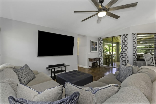 living room featuring vaulted ceiling, dark wood-type flooring, and ceiling fan